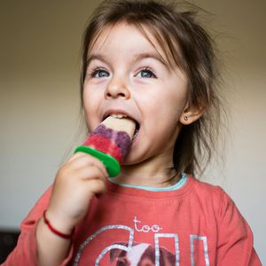 Sofia Kravchuk smiling in professional athletic wear.